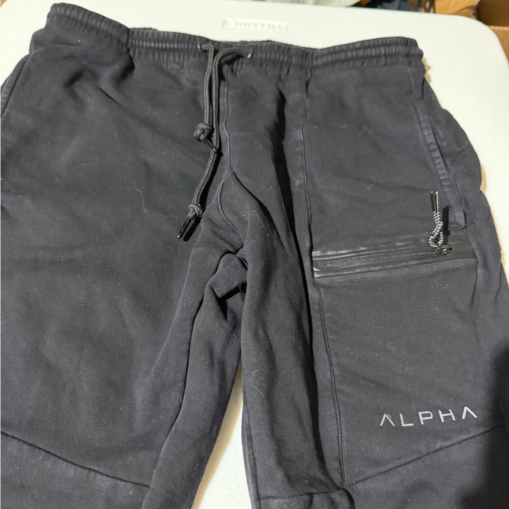 Men's Alpha Black Sweat Pants. Zipper bottoms. Very Nice. Fleece Lining.